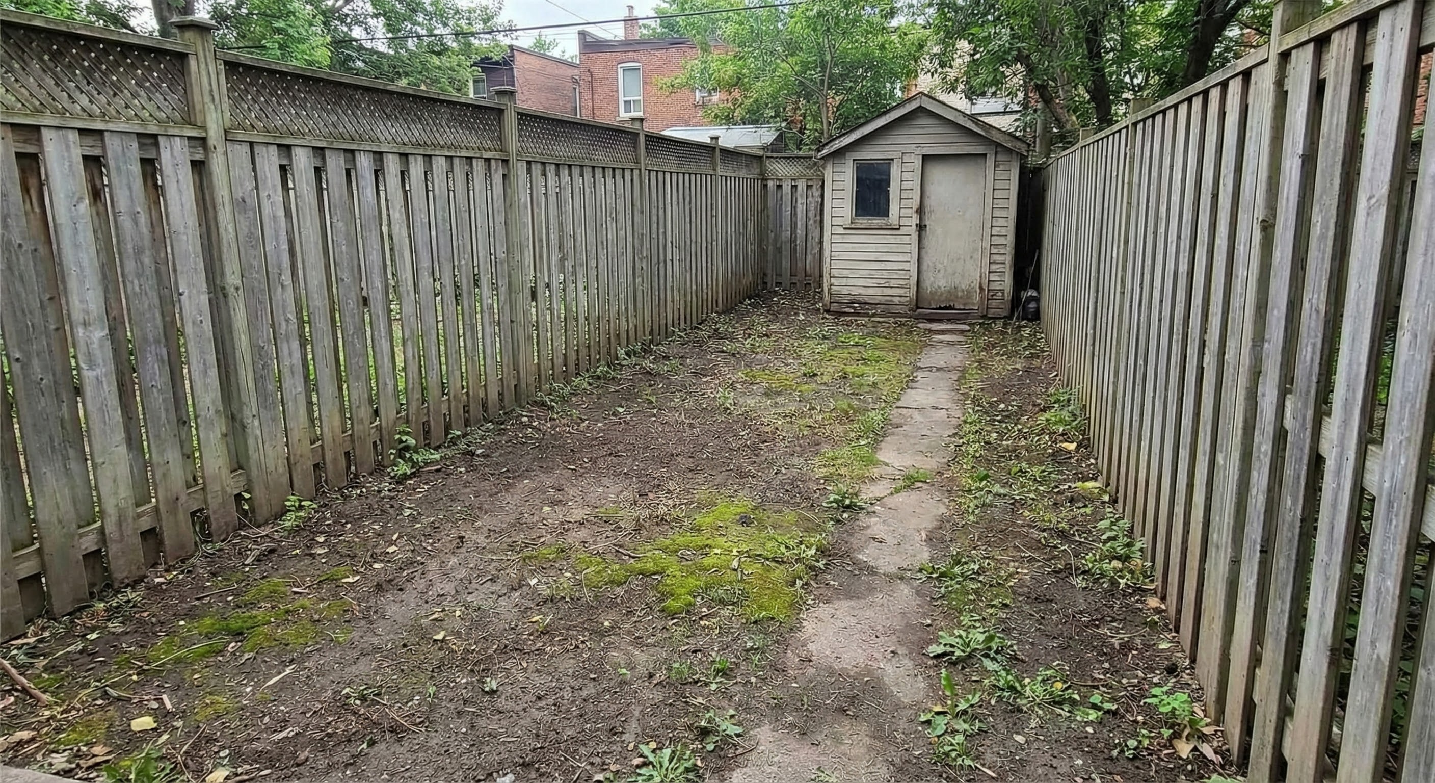 Muddy backyard before artificial turf